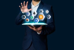 Cryptocurrency altcoin, Business man holding tablet showing growing virtual hologram of altcoin crypto and bitcoin, xrp, chainlink