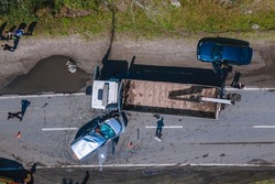 The truck and the car collided on the highway. Strong accident. Traffic accidents on the road. View from above. Traffic jam on the road. DNIPRO, UKRAINE – August 11, 2021