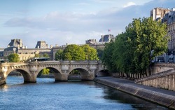 Beautiful picture of the Pont Neuf over the Seine river in the French city of Paris. Paris is divided by the Seine river and this beautiful European city is full of beautiful bridges.