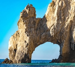 The famous and beautiful arch of Cabo San Lucas in the Gulf of California that joins the sea of cuts with the Pacific Ocean at the end of the land, in Baja California Sur. Beach concept in Mexico.