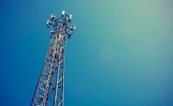 Telecom mast or Telecommunication mast TV antennas wireless technology with blue sky background, Show telecom tower infrastructure. Vintage concept