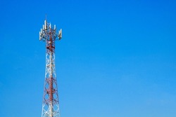 Telecom mast or Telecommunication mast TV antennas wireless technology with blue sky background, Show telecom Red and white tower infrastructure.