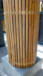 the perspective view from natural bamboo slat in parallel and round position part of the restaurant building construction as architectural design element