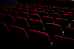 Texture with red chairs in an empty cinema or theater