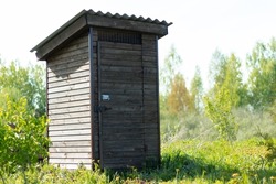 wooden toilet on the street,in the village in summer