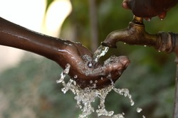 Climate Change Symbol: Handful Of Water Scarsity for Africa Symbol