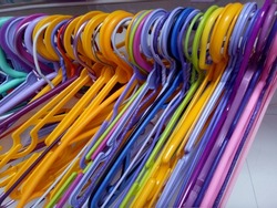 Row of Colorful Cloth Hanger. Plastic Cloth Hanger