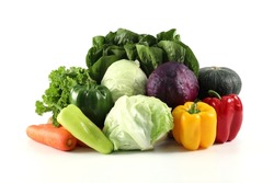 Fresh Vegetables, Cabbage, Purple Cabbage, Carrot, Pumpkin, Green sweet pepper, Red sweet pepper, Yellow bell pepper, green bell pepper and lettuce salad put together on a white background