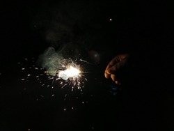 sparkling crackers in dark background