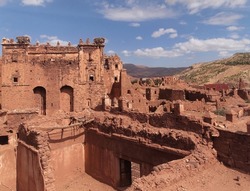View of a Kasbah Telouet (Ruins of Glaoui) with the High Atlas mountains in the background, Telouet, near Ouarzazate, Morocco