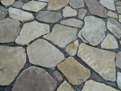 Cobblestone street close up. Gray Cut Stone Wall Background. Abstract wall stone pattern