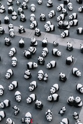 Many panda sculptures view from above that place on the floor is an art exhibition in Bangkok, Thailand.