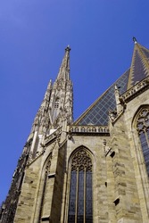 View of the tower of the St. Stephan Domkirche of Vienna from the ground against a blue sky in april.