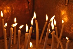 candles burning inside the church. christian ceremony.