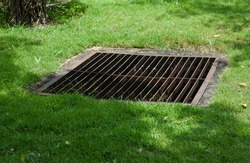 Grate off the drain on the lawn.