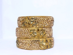 Traditional Golden Bangles. Selective focus on golden bangles.