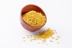 Moong Dal Namkeeen, Indian Namkeen Snack Food, Moong dal isolated served in a brown colored bowl on white background.
Mixture, Yellow split salty mung dal or moong dal namkeen.