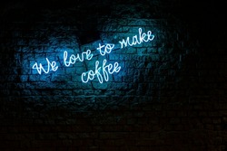 Coffee text neon sign wall written by coffee lovers. High-resolution editing image source.