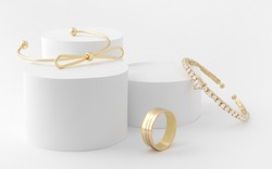 Golden girl accessories two golden bracelets and ring on white background