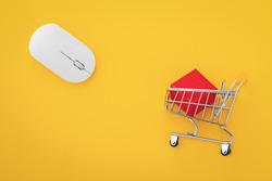 Wireless mouse with shopping cart on yellow background, online shopping concept, top view