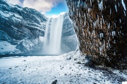 Majestic nature of winter Iceland. Impressively View on Skogafoss Waterfal. Skogafoss the most famous place of Iceland
