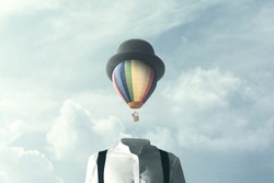 man with big balloon fly on his head, surreal concept