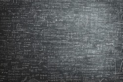 dirty grunge chalkboard full of mathematical problems and formula