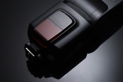 Camera external flash speed light on black background
