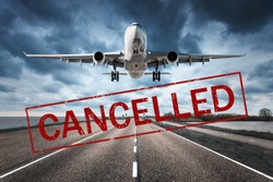 Canceled flights in Europe and USA airports. Travel vacations cancelled because of pandemic of coronavirus. Flying passenger airplane and runway. Flight cancellation. Aircraft with text. Covid-19