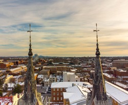 Aerial view of downtown Frederick Maryland through the Evangelical Lutheran Church steeples February 21, 2021