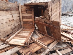 abandoned broken wooden brown crates 