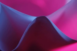 Office printing paper with folds forming triangles and curved waves with blue and pink light, forms a very original abstract design with bokeh background