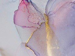 Abstract purple art with pink and gold — violet background with beautiful smudges and stains made with alcohol ink. Pink fluid texture resembles marble, flowers, butterfly, watercolor or aquarelle.