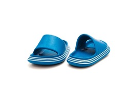 Trending pair of open toe pillow slide sandals for toddler isolated on white background. Cushioned foam slippers for boys and girls