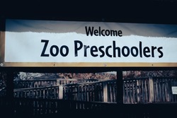 Toned photo welcome zoo preschoolers sign for kindergarten students field trips at North Texas, America. Cute welcoming texts for school kids activities.