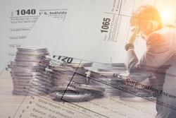 Double exposure of US tax form and coins with stress businessman for business taxation and finance concept