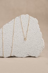 Elegant jewelry set of the gold pendant. Jewelry pendant. Product still life concept