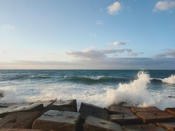 Waves crush into stones at Alexandria Egypt shore 