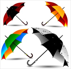 Set of different colored umbrellas in the rain drops.