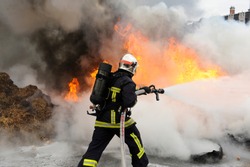 firefighter extinguishes a fire