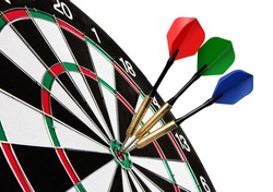 Colorful darts hitting a target, isolated on white