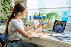 Online drawing lesson, teenage girl having video conference with teacher