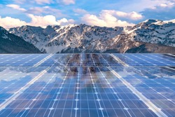 Solar panel over winter mountain background. solar power green energy for life concept 