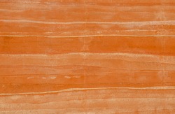 Brown Rammed earth wall grunge texture background. Compacted clay wall with layers of different colored incorporation striations of natural earth tone colors creates a warm, nature-friendly atmosphere