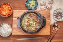 Beef bone soup or Seolleongtang The Most COMFORTING Korean food Served with kimchi, steamed rice, a popular Korean dish.