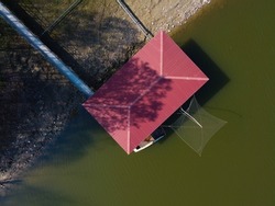 Zenit view of houseboat on the lake. Gualtieri, Italy. High quality photo