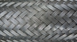 Metal wire braiding. Steel texture. Background.