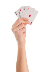 Close-up Of Hand Holding Four Aces On White Background