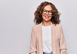 Middle age beautiful businesswoman wearing glasses standing over isolated white background with a happy and cool smile on face. Lucky person.
