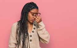 African american woman wearing casual clothes tired rubbing nose and eyes feeling fatigue and headache. stress and frustration concept. 
